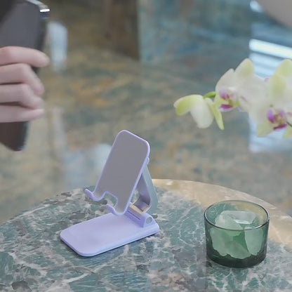 Universal folding bracket for mobile phones and tablets